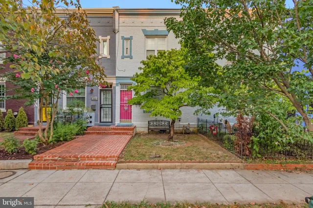 a view of a building with a yard