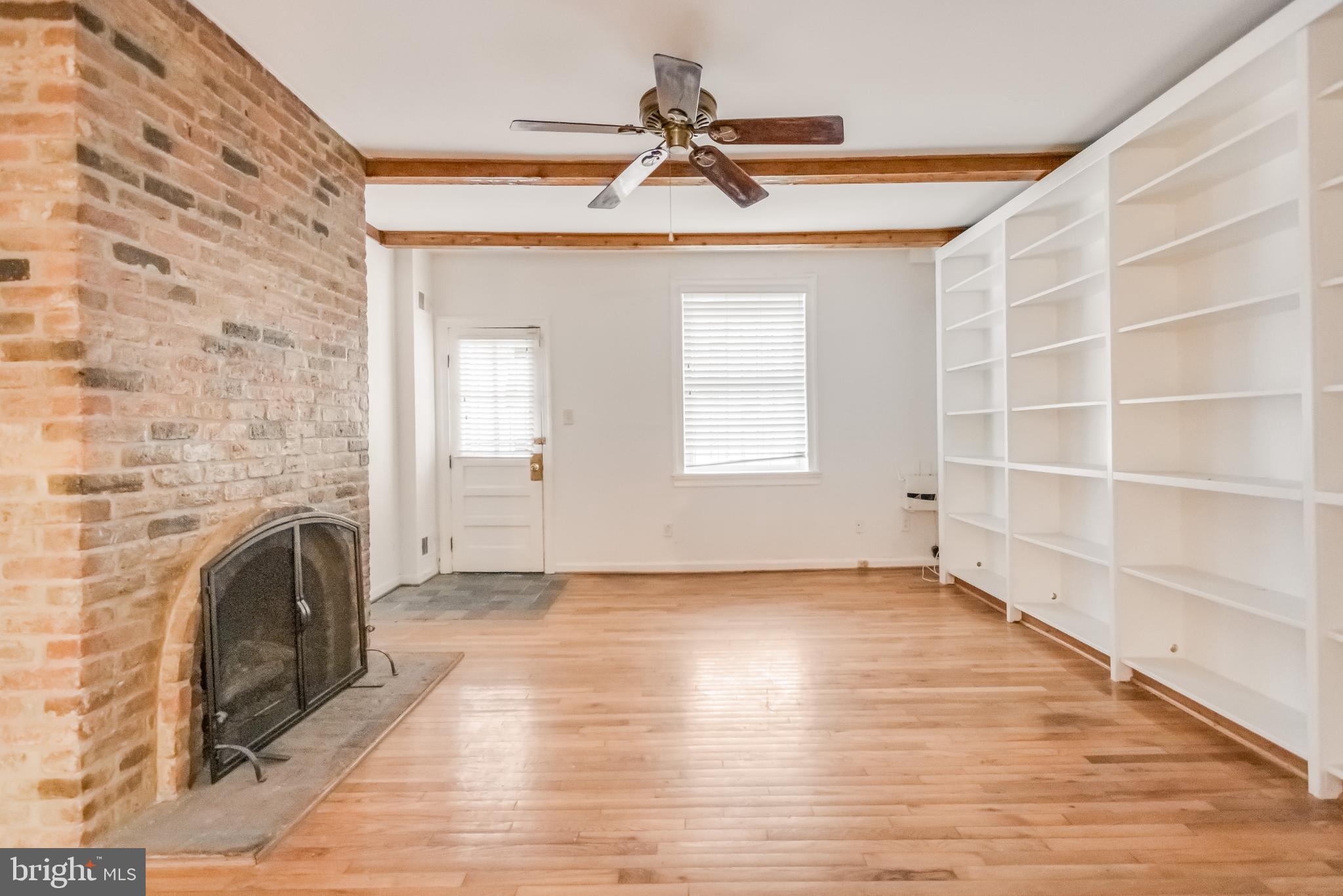 107 15th Street Northeast Washington, DC 20002 - Photo 13 of 30 a view of empty room with a fireplace and wooden floor
