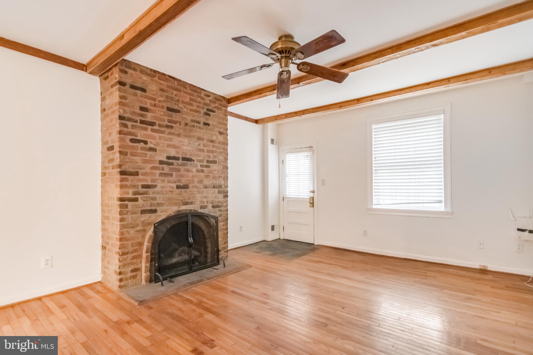 107 15th Street Northeast Washington, DC 20002 - Photo 16 of 30 a view of empty room with a fireplace and wooden floor