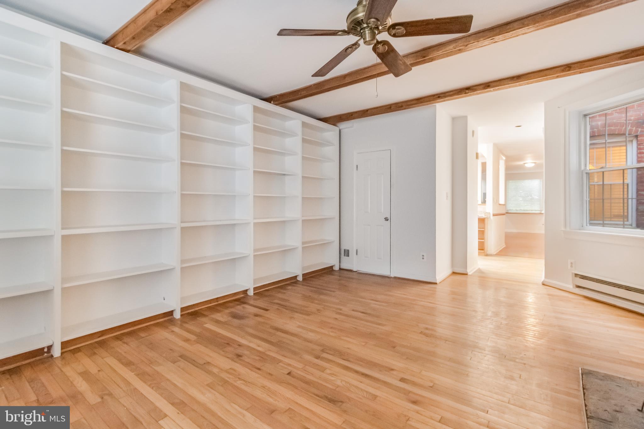 107 15th Street Northeast Washington, DC 20002 - Photo 18 of 30 a view of an empty room with a window and wooden floor
