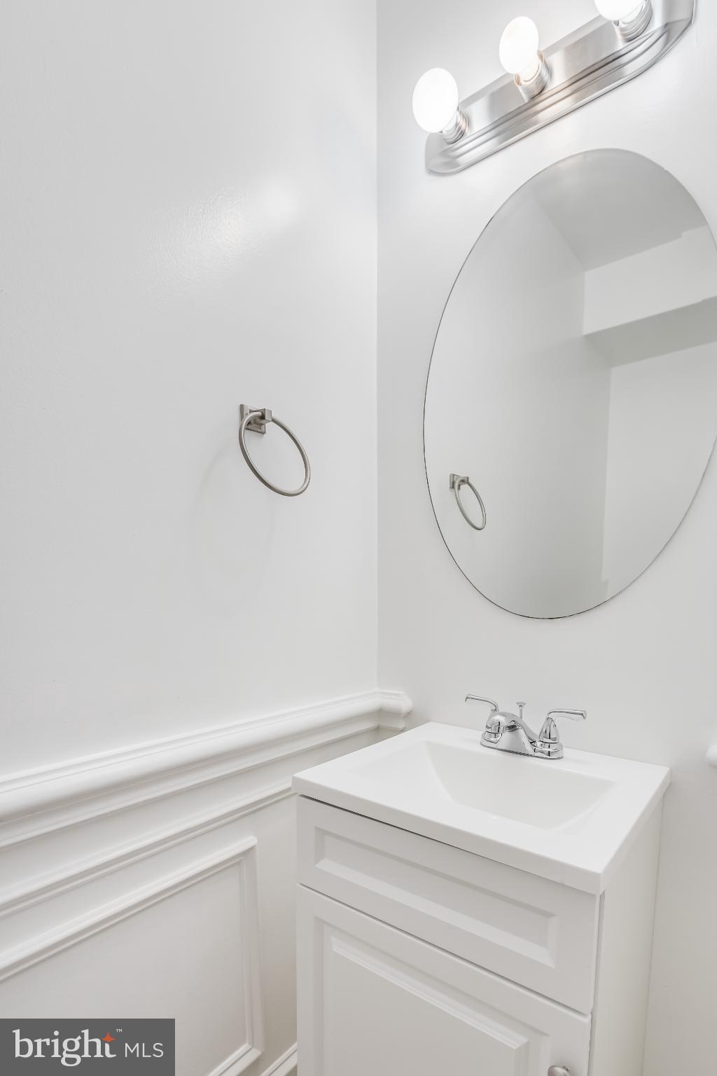 107 15th Street Northeast Washington, DC 20002 - Photo 19 of 30 a bathroom with a sink and mirror