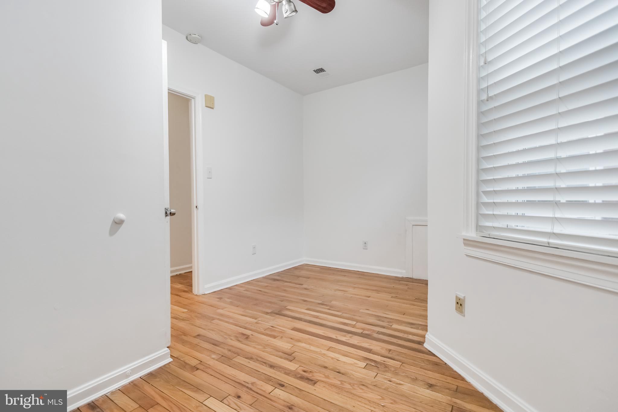 107 15th Street Northeast Washington, DC 20002 - Photo 27 of 30 a view of an empty room with wooden floor and a window