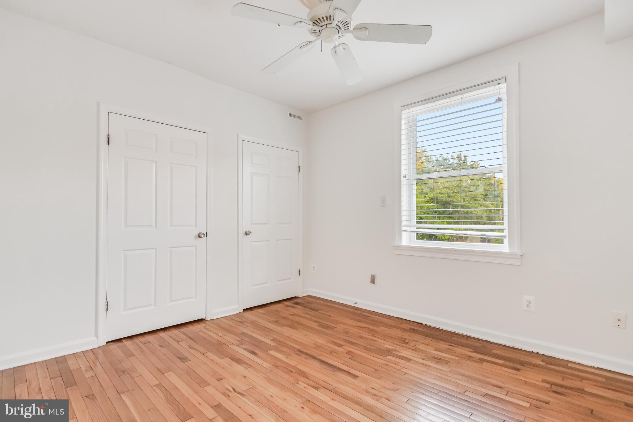 107 15th Street Northeast Washington, DC 20002 - Photo 29 of 30 a view of an empty room with wooden floor and a window