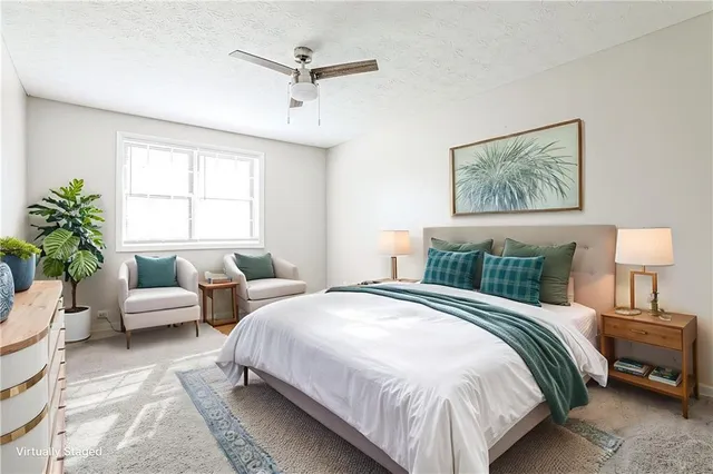 a bedroom with bed and a window