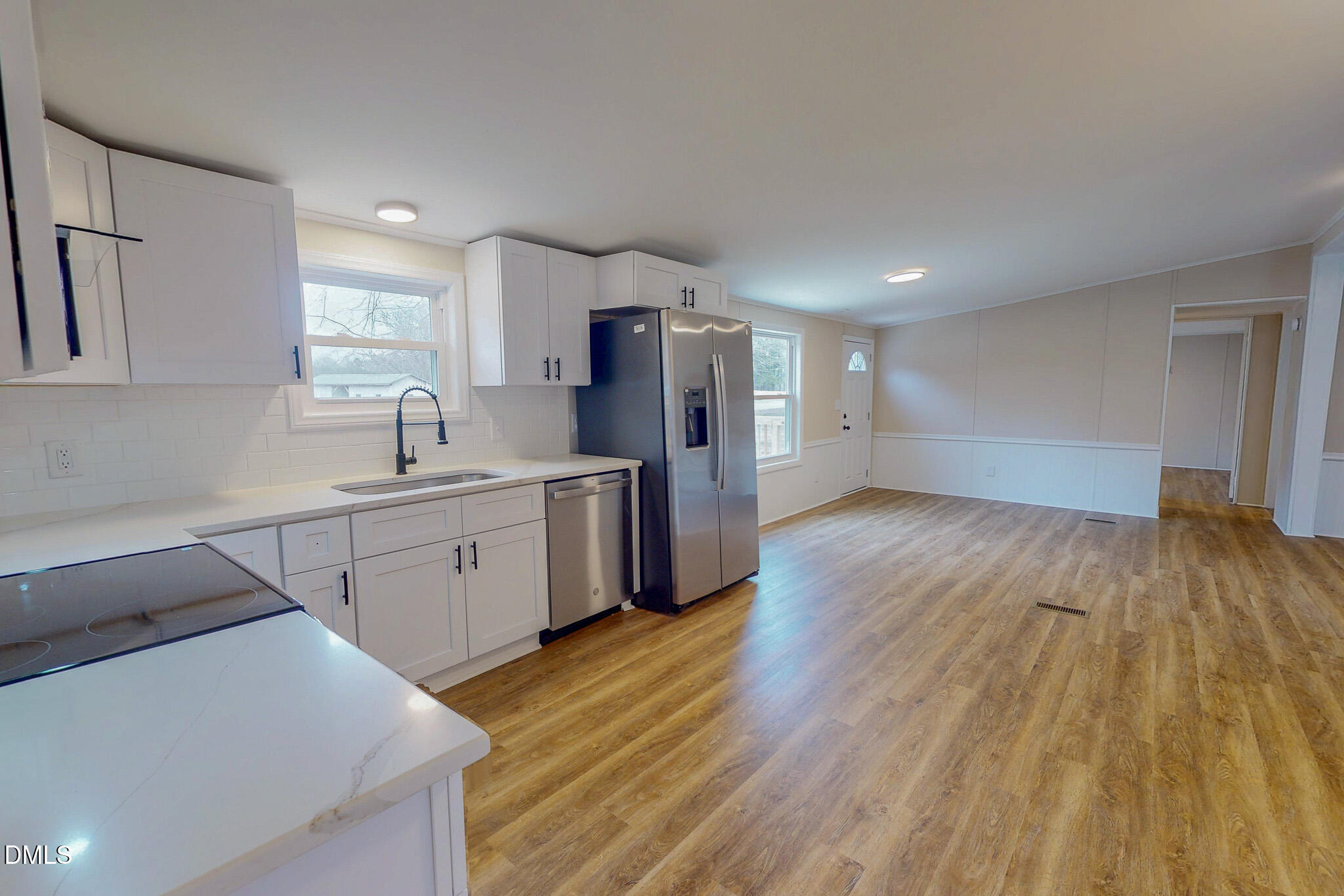 67 Halifax Road Roxboro, NC 27574 - Photo 4 of 48 a kitchen with a sink and wooden floor