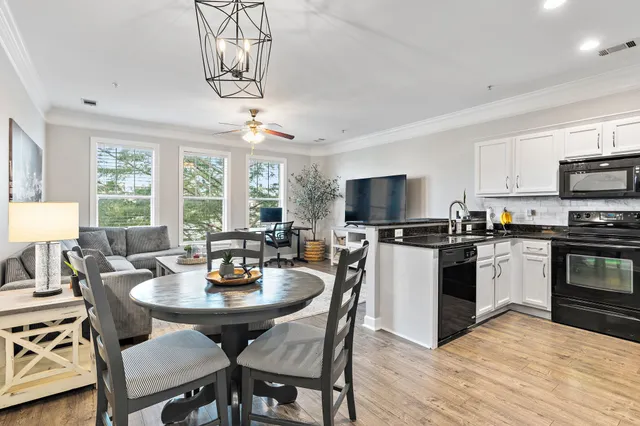 a kitchen with a dining table and chairs