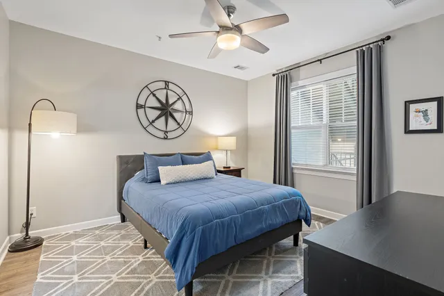 a bedroom with a bed and a table in it