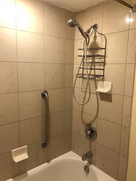 36750 US Highway 19 North, Unit 23107 Palm Harbor, FL 34683 - Photo 11 of 16 a bathroom with a shower
