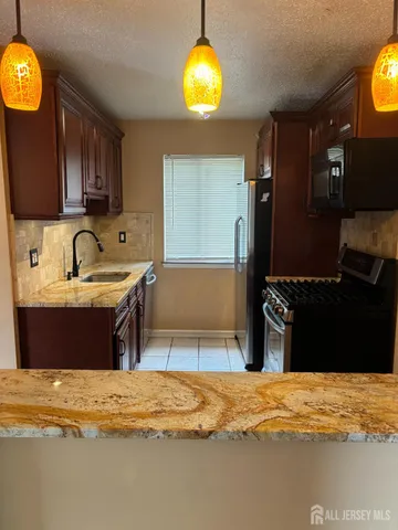 a bathroom with a tub and a sink