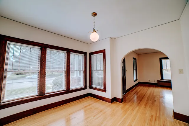 a view of an entryway with wooden floor