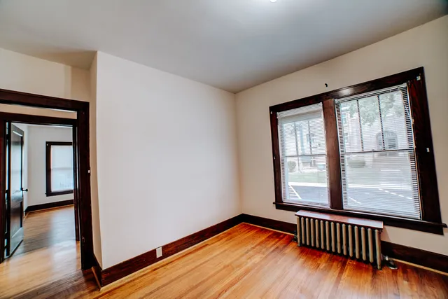 a view of room with wooden floor