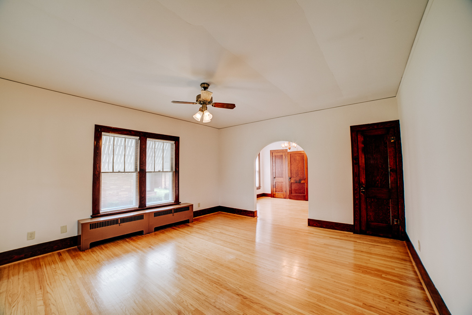 317 South 4th Street Watseka, IL 60970 - Photo 9 of 40 a view of an empty room with window and wooden floor