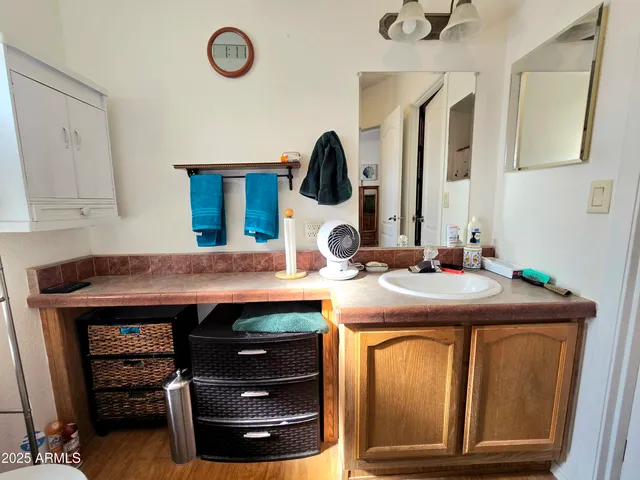 a bathroom with a sink and a mirror