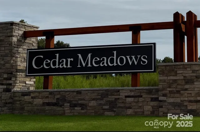 a bathroom with a sink a toilet and a large mirror
