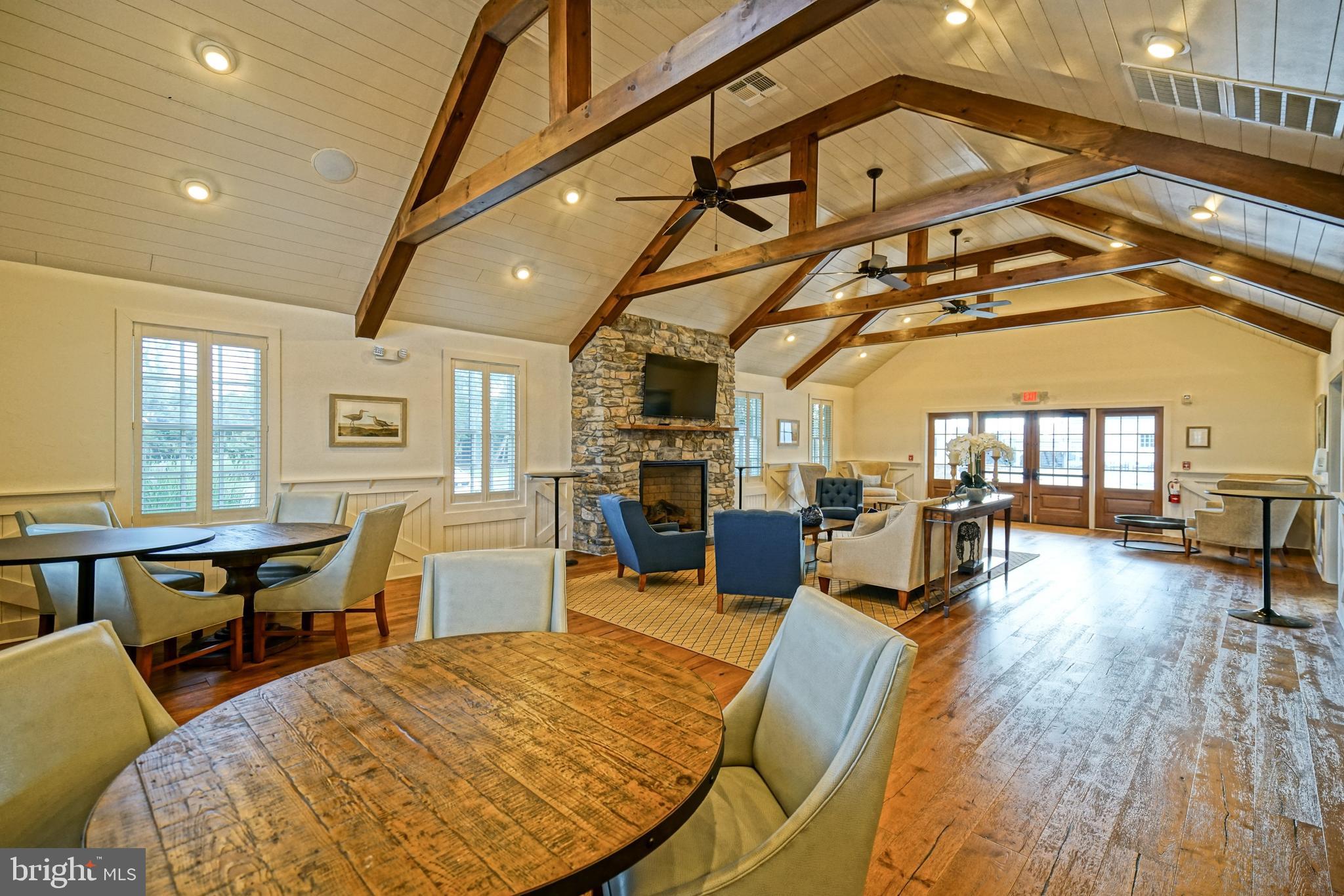 36903 Crossrail Way Lewes, DE 19958 - Photo 111 of 120 a living room with furniture and a wooden floor