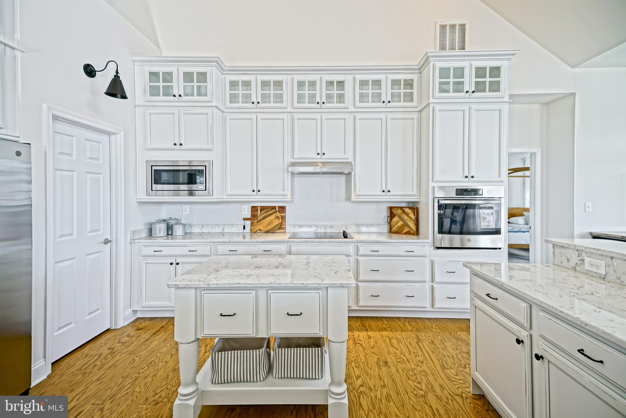 36903 Crossrail Way Lewes, DE 19958 - Photo 22 of 120 a kitchen with cabinets appliances and a counter space