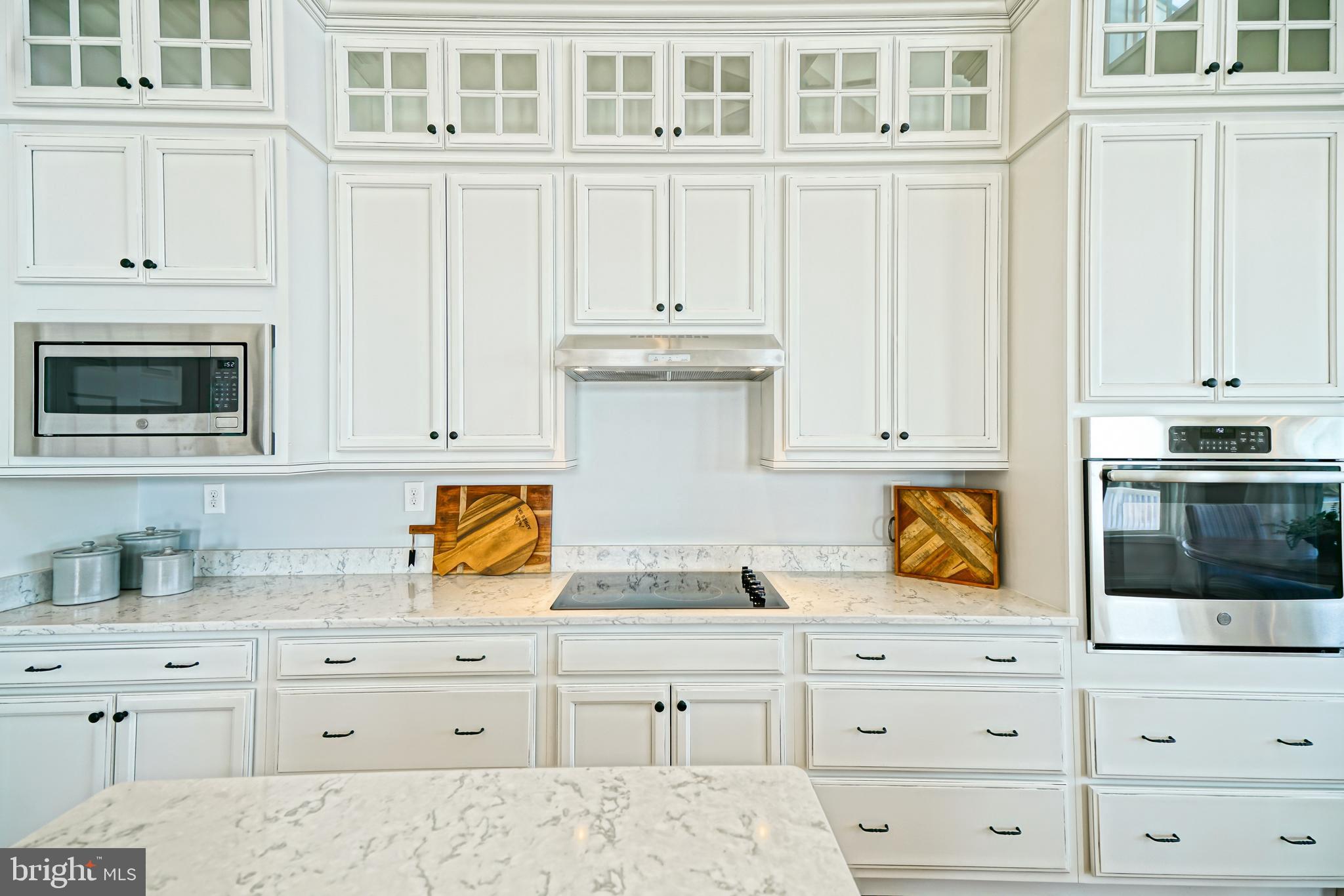 36903 Crossrail Way Lewes, DE 19958 - Photo 24 of 120 a kitchen with stainless steel appliances granite countertop white cabinets and a sink