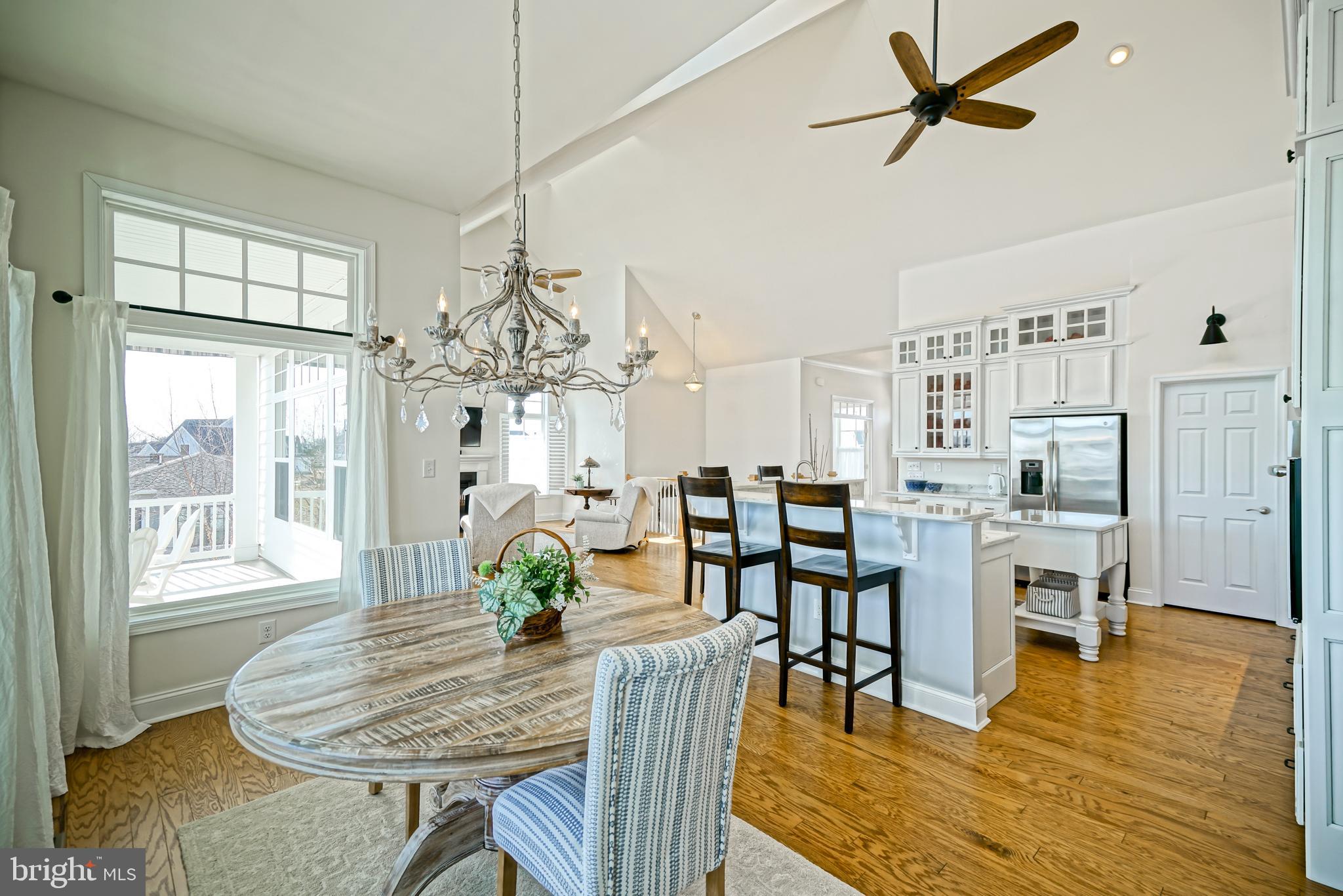 36903 Crossrail Way Lewes, DE 19958 - Photo 29 of 120 a view of a dining room with furniture window and wooden floor