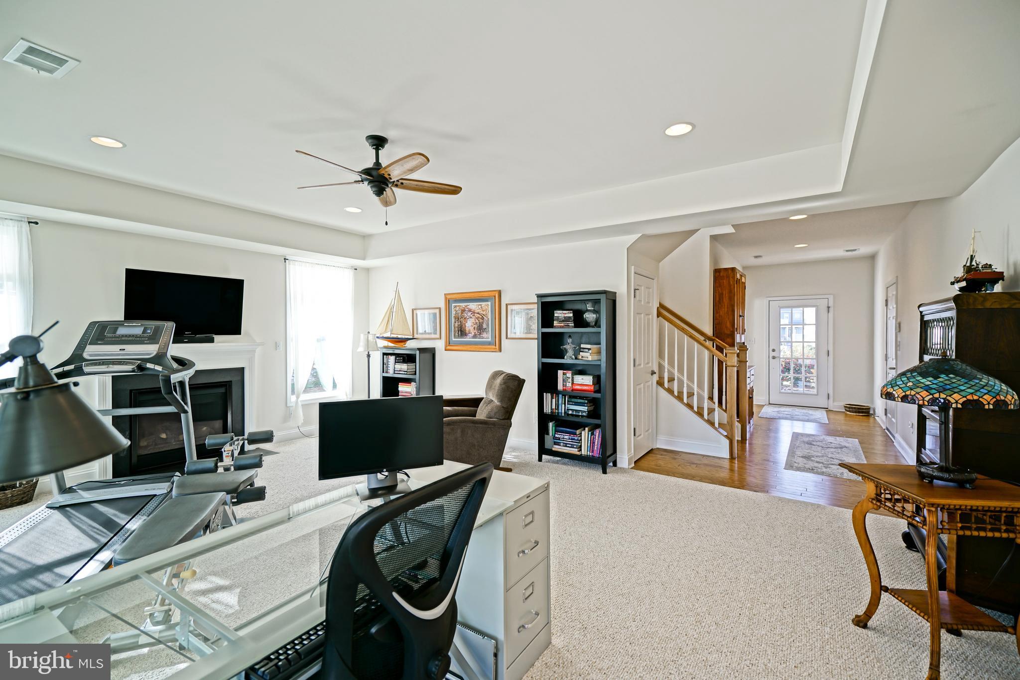 36903 Crossrail Way Lewes, DE 19958 - Photo 63 of 120 a view of a workspace with furniture and a flat screen tv