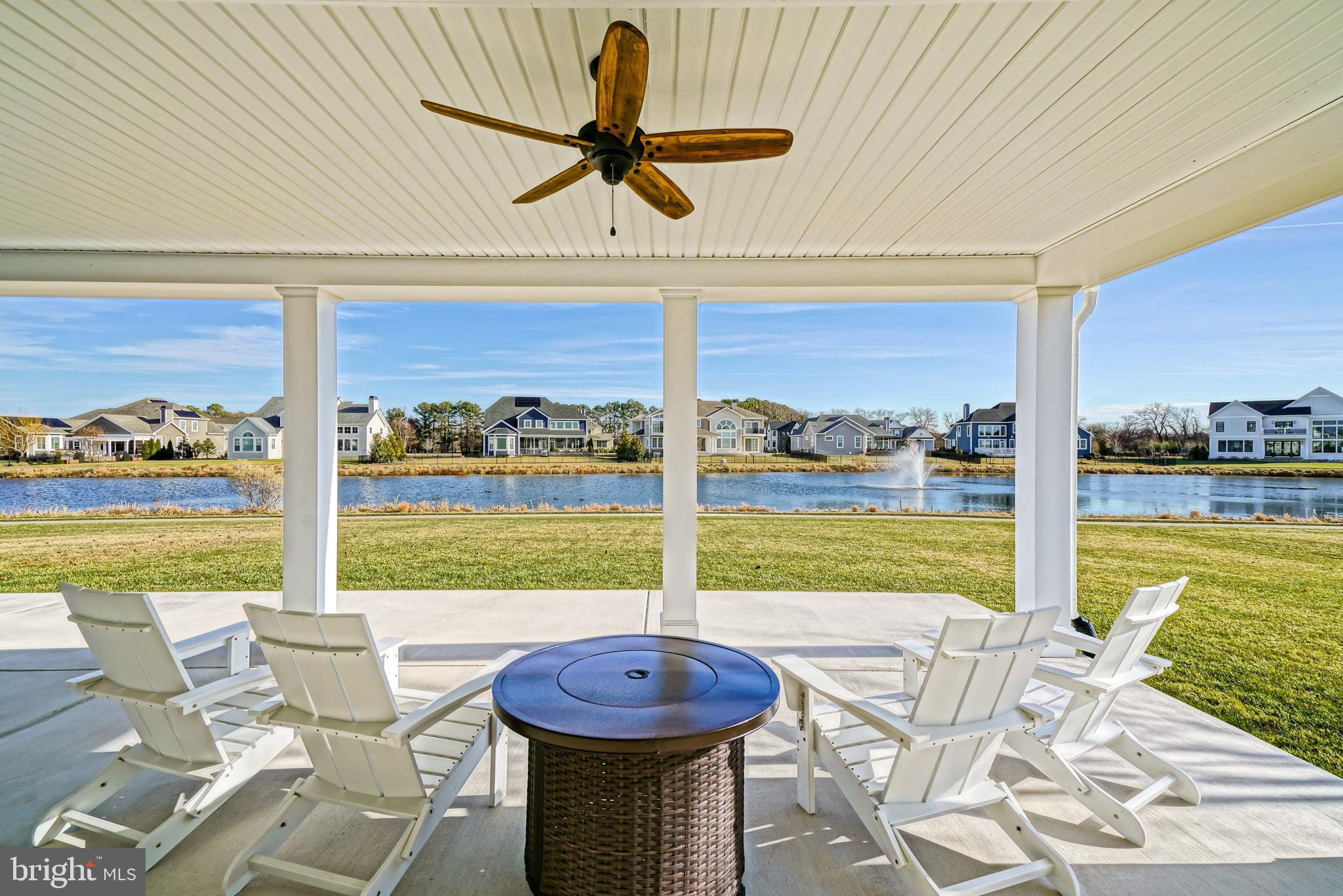 36903 Crossrail Way Lewes, DE 19958 - Photo 80 of 120 a view of a patio with a table chairs and a table