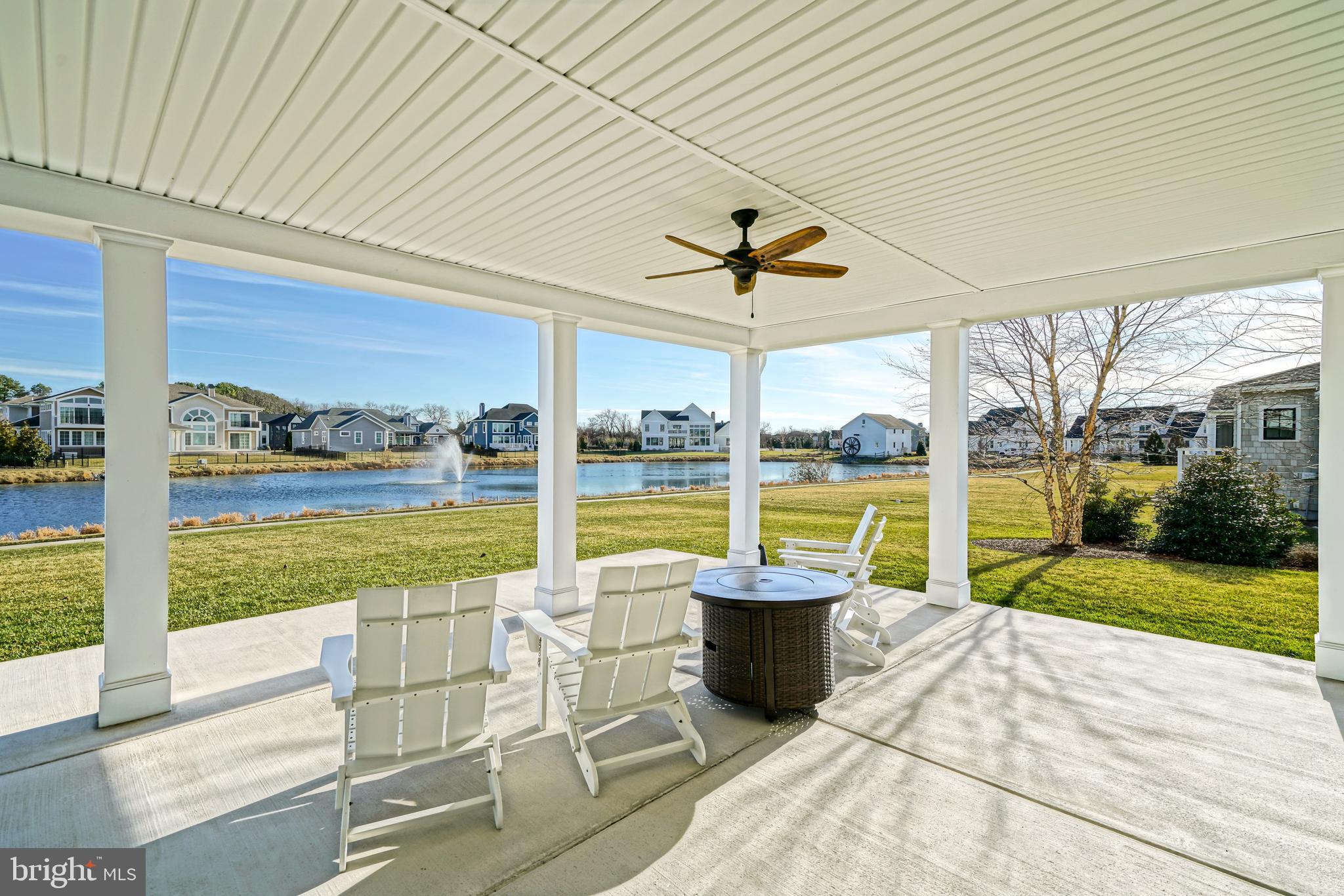 36903 Crossrail Way Lewes, DE 19958 - Photo 81 of 120 a view of a patio with a dining table chairs and balcony