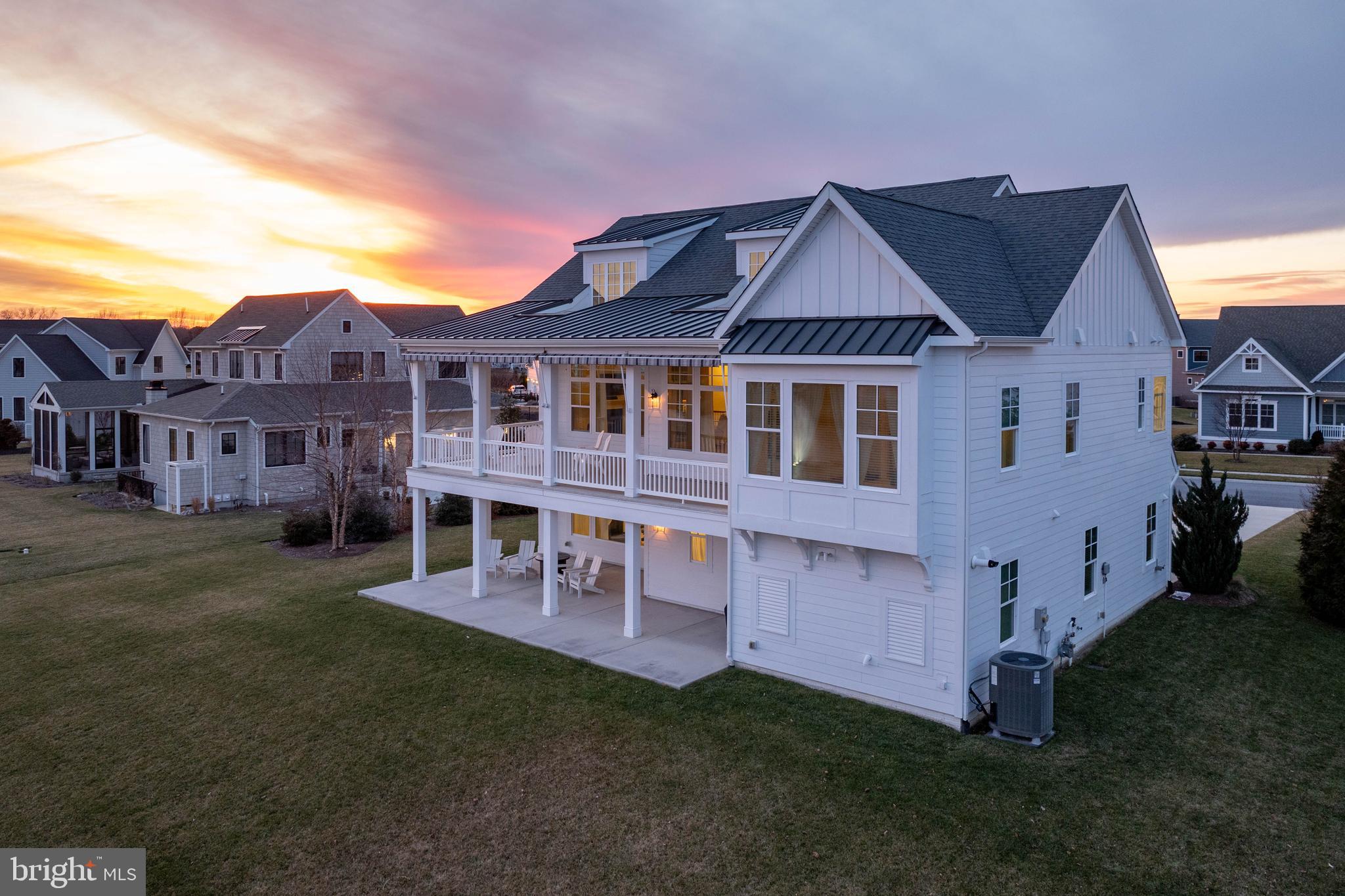 36903 Crossrail Way Lewes, DE 19958 - Photo 93 of 120 a view of a big house with a big yard and large trees