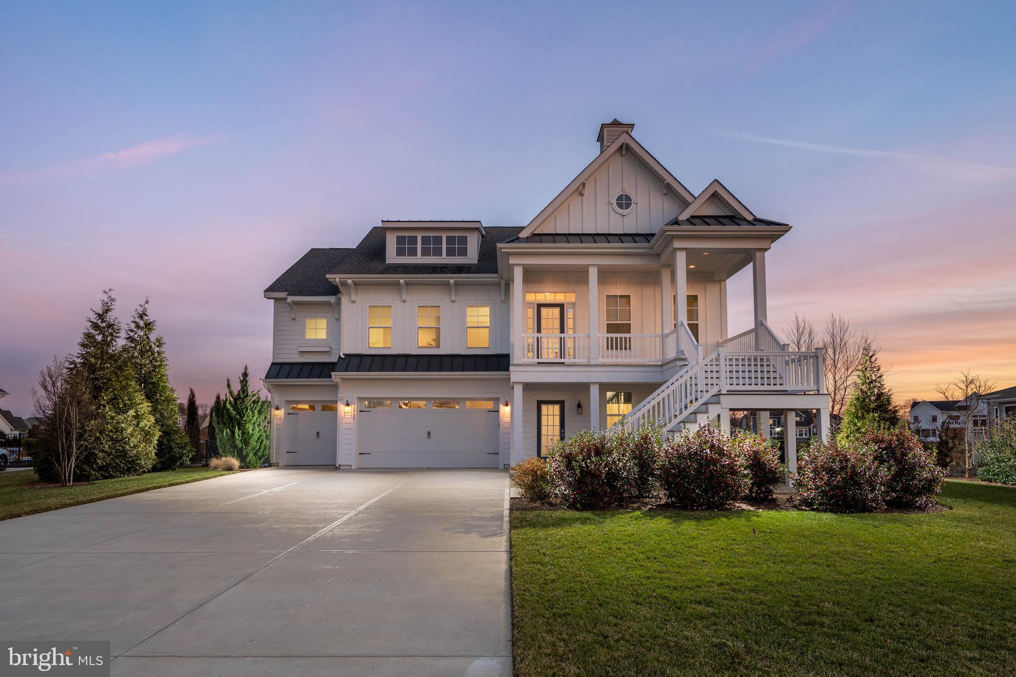 36903 Crossrail Way Lewes, DE 19958 - Photo 96 of 120 a front view of a house with a yard and garage