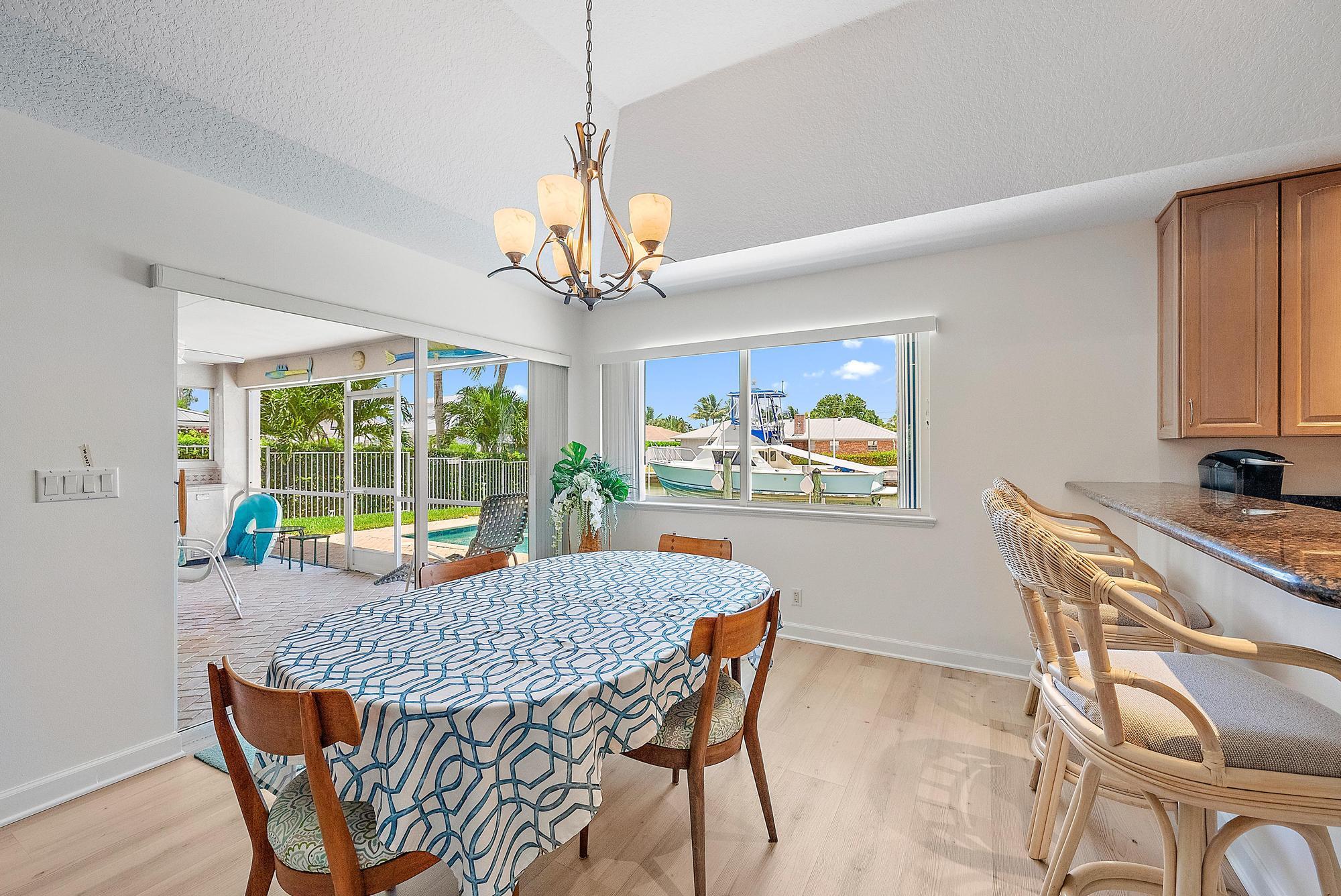 925 Dolphin Drive Jupiter, FL 33458 - Photo 9 of 37 a view of a dining room with furniture window and outside view
