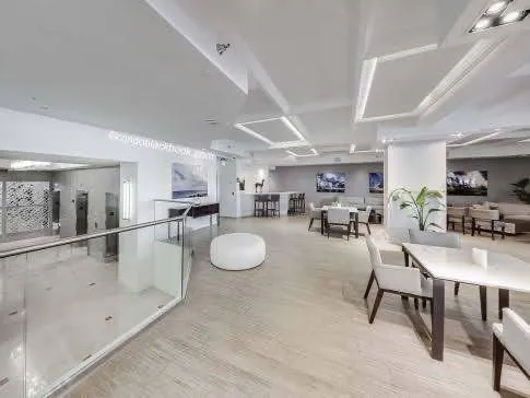 a kitchen with sink and view of living room