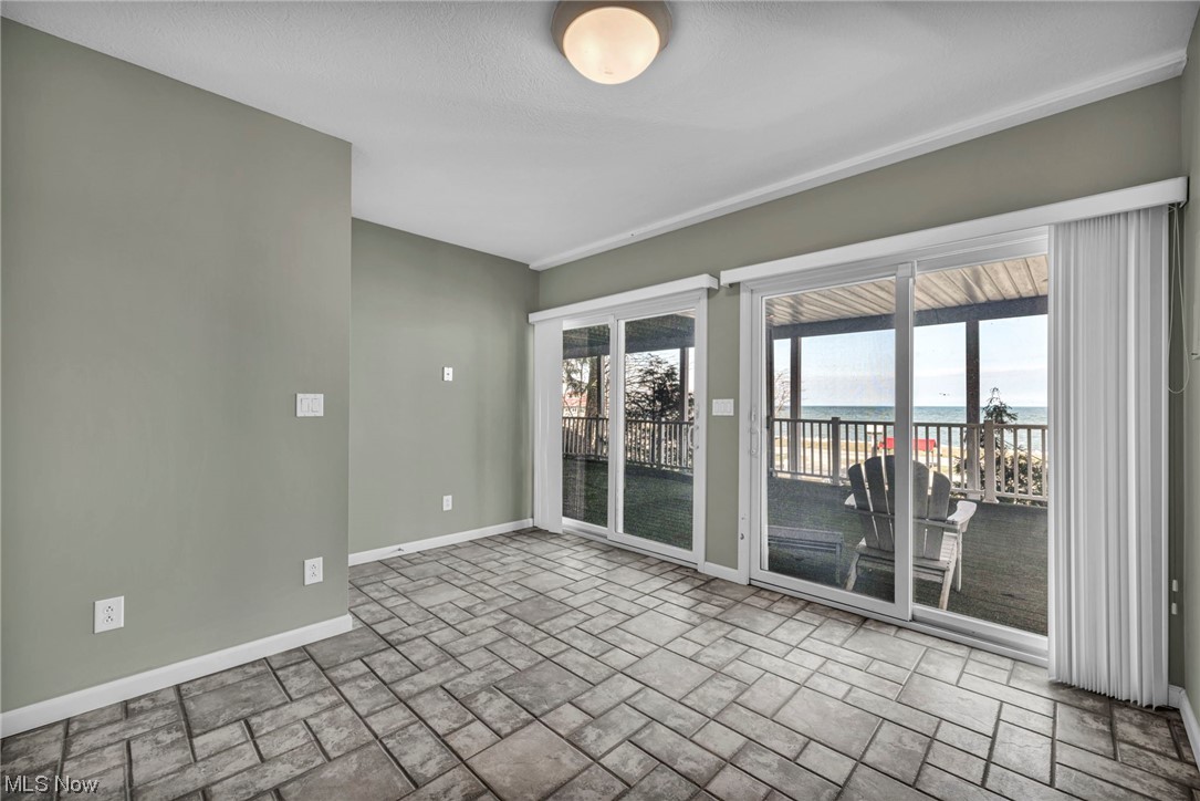 4741 Lake Road West Ashtabula, OH 44004 - Photo 36 of 43 Empty room featuring a water view