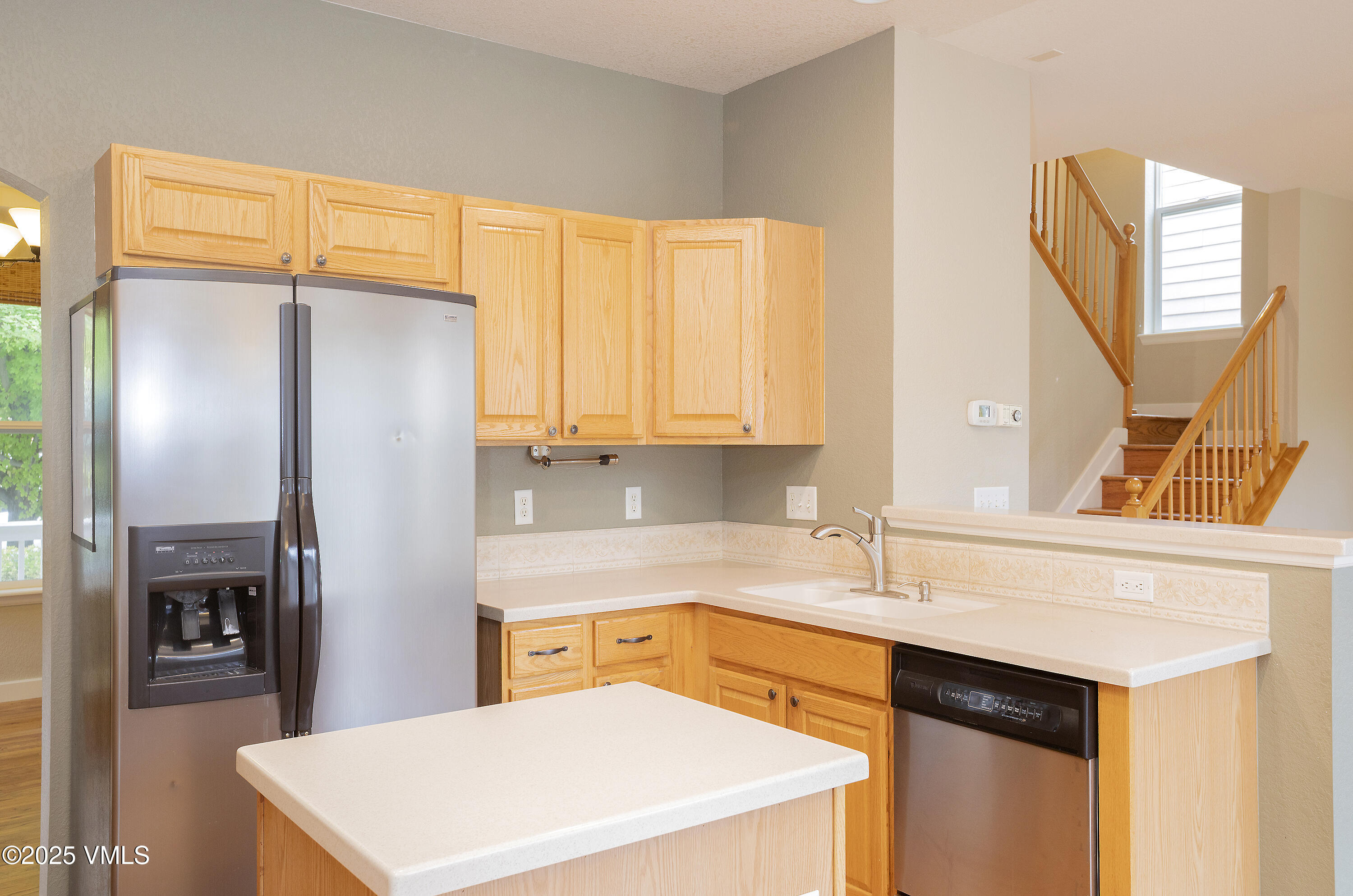 95 Eagle Ranch Road Eagle, CO 81631 - Photo 11 of 31 a kitchen with stainless steel appliances a refrigerator sink and cabinets