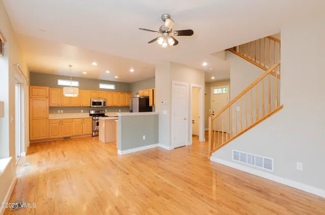 a view of kitchen with cabinets and wooden floor
