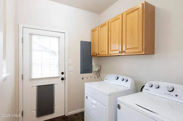 a view of storage and utility room with washer and dryer