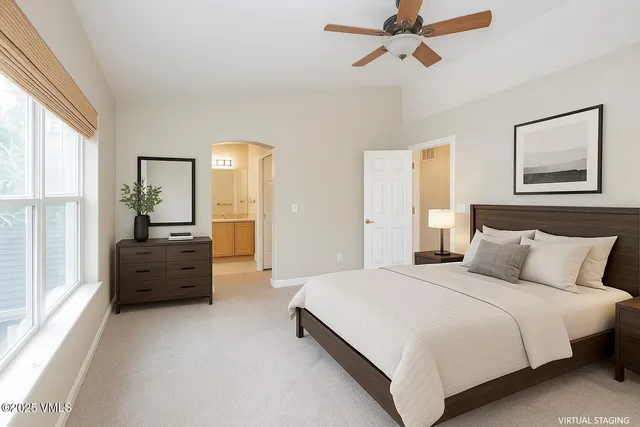 a bedroom with a bed and a couch