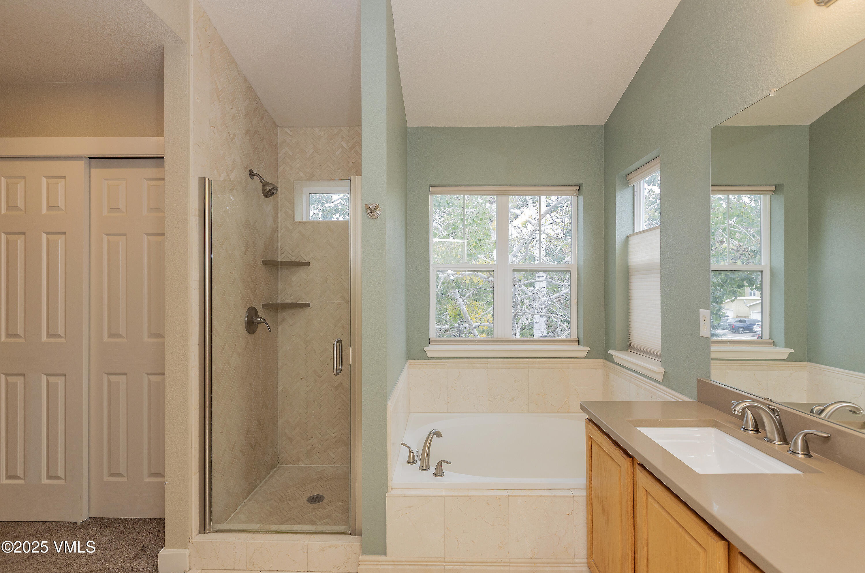 95 Eagle Ranch Road Eagle, CO 81631 - Photo 23 of 31 a bathroom with a tub sink vanity and windows