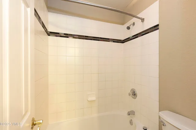 a bathroom with a shower and a bathtub