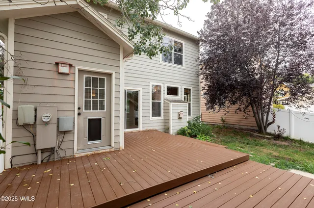a view of house with backyard and garden