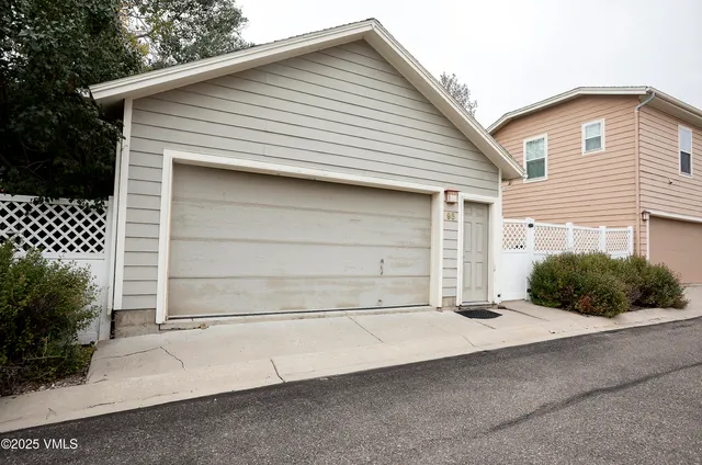 a front view of a house with a garage