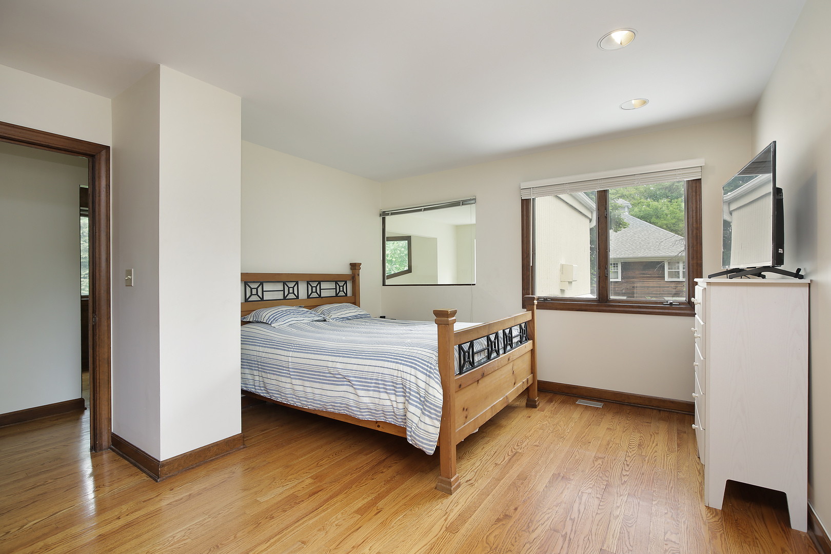 2653 Sheridan Road Evanston, IL 60201 - Photo 13 of 17 a bedroom with a bed and a large window