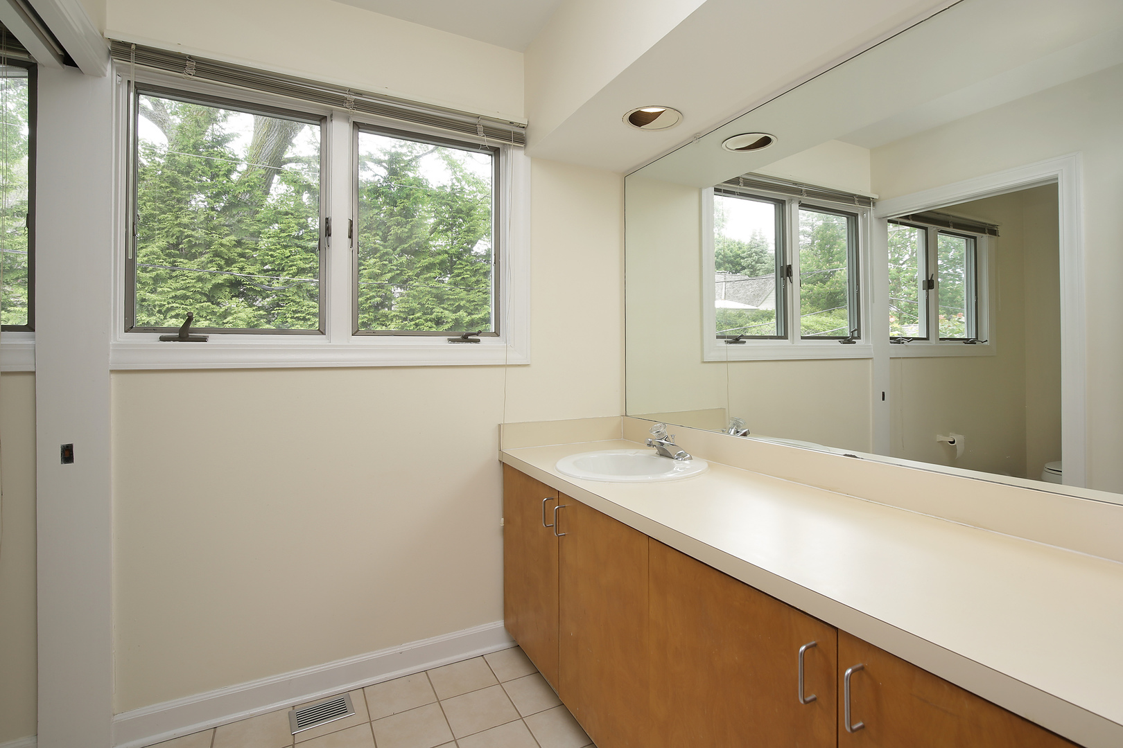 2653 Sheridan Road Evanston, IL 60201 - Photo 14 of 17 a bathroom with a sink and a window