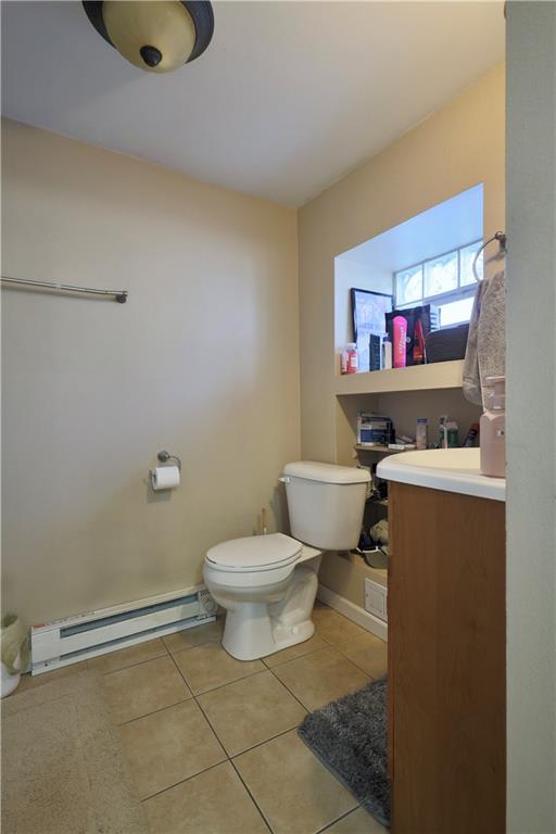1923 Wharton Street Pittsburgh, PA 15203 - Photo 17 of 34 a bathroom with a toilet sink vanity and mirror