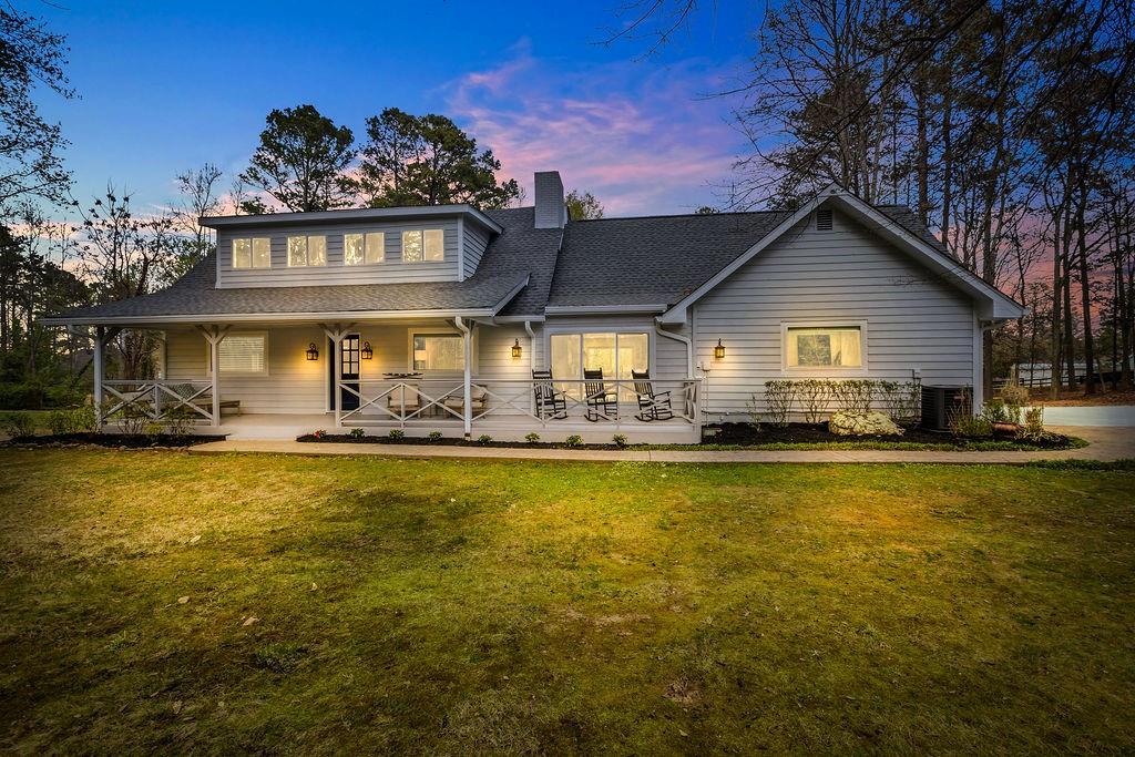 12 Providence Way Milton, GA 30004 - Photo 1 of 56 a front view of a house with swimming pool