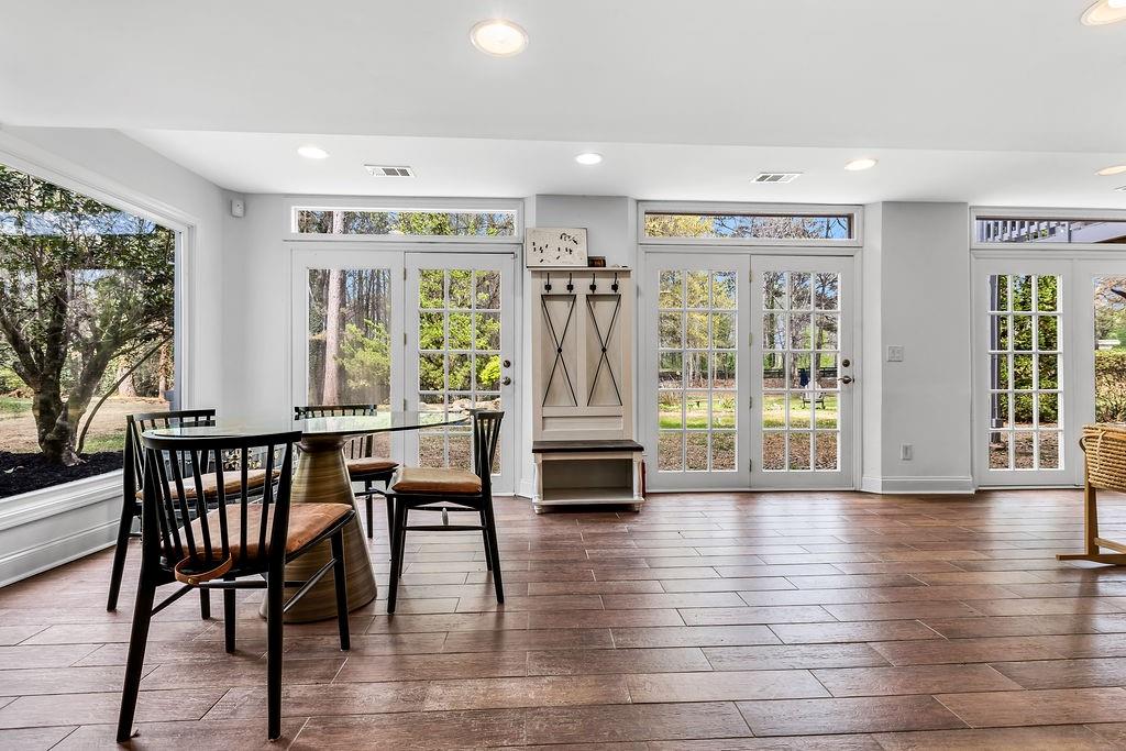 12 Providence Way Milton, GA 30004 - Photo 19 of 56 a view of a dining room with furniture window and wooden floor