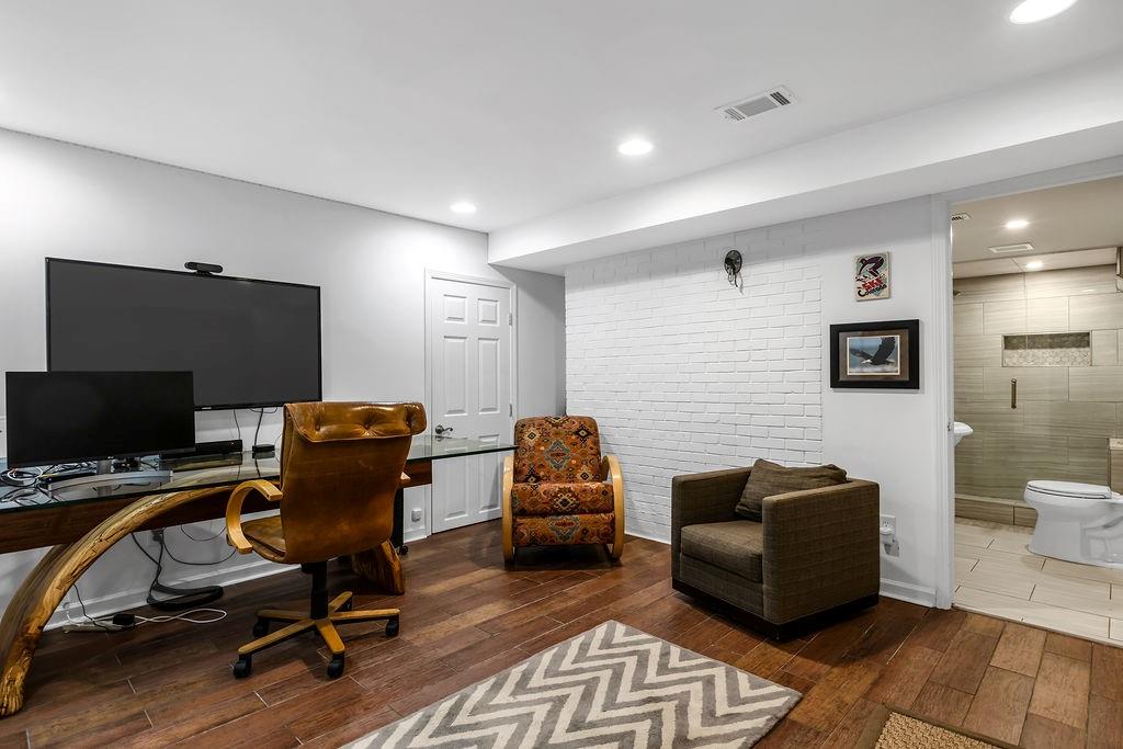 12 Providence Way Milton, GA 30004 - Photo 21 of 56 a livingroom with workspace and a couch