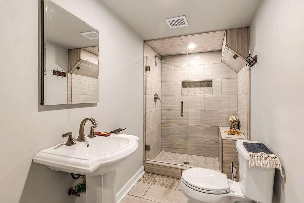 12 Providence Way Milton, GA 30004 - Photo 22 of 56 a bathroom with a sink toilet and shower