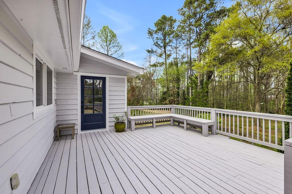 12 Providence Way Milton, GA 30004 - Photo 24 of 56 a view of a roof deck with wooden floor and fence with a bench
