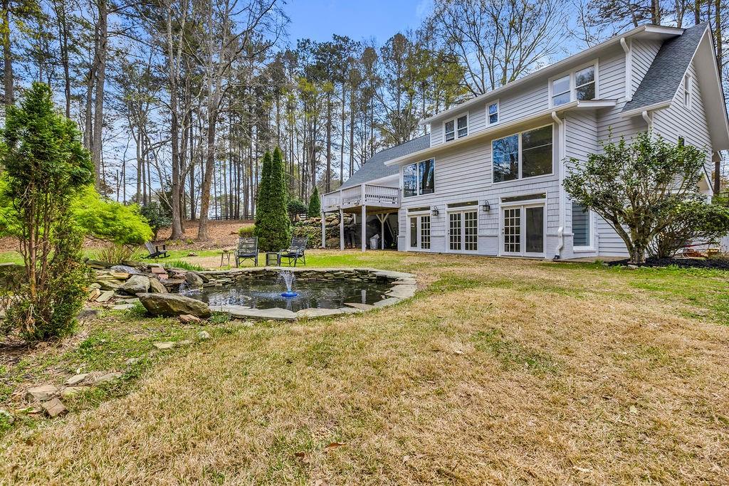 12 Providence Way Milton, GA 30004 - Photo 29 of 56 a view of a house with a yard and sitting area