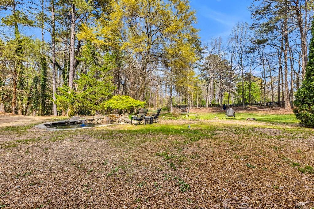 12 Providence Way Milton, GA 30004 - Photo 33 of 56 a view of swimming pool with an outdoor space