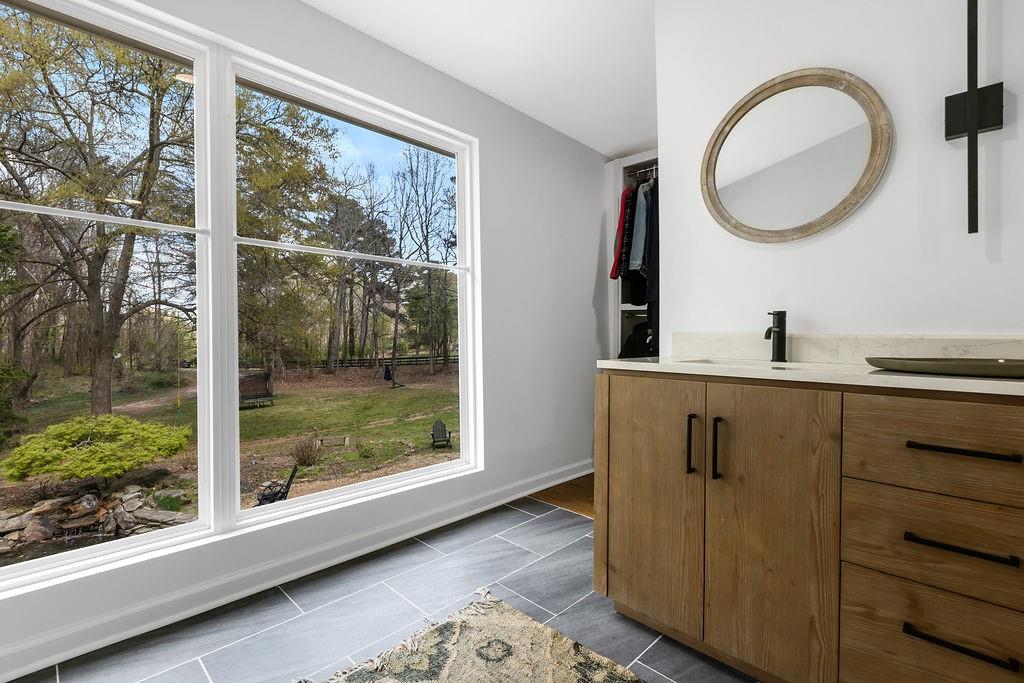 12 Providence Way Milton, GA 30004 - Photo 44 of 56 a bathroom with a mirror and a window