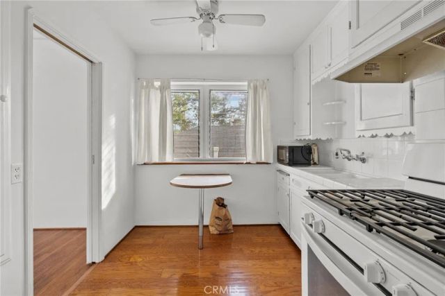 a kitchen with sink cabinets and window
